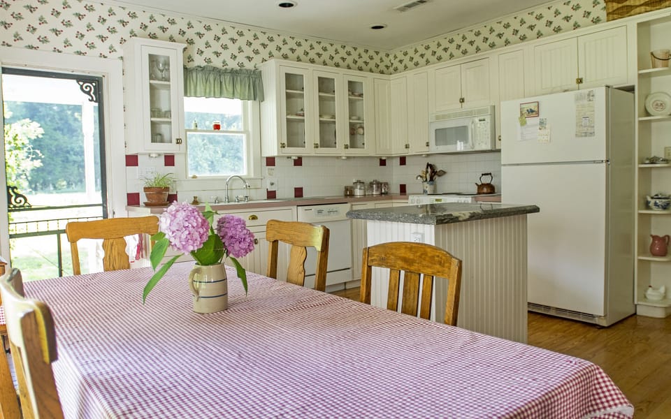 The kitchen table seats six to eight