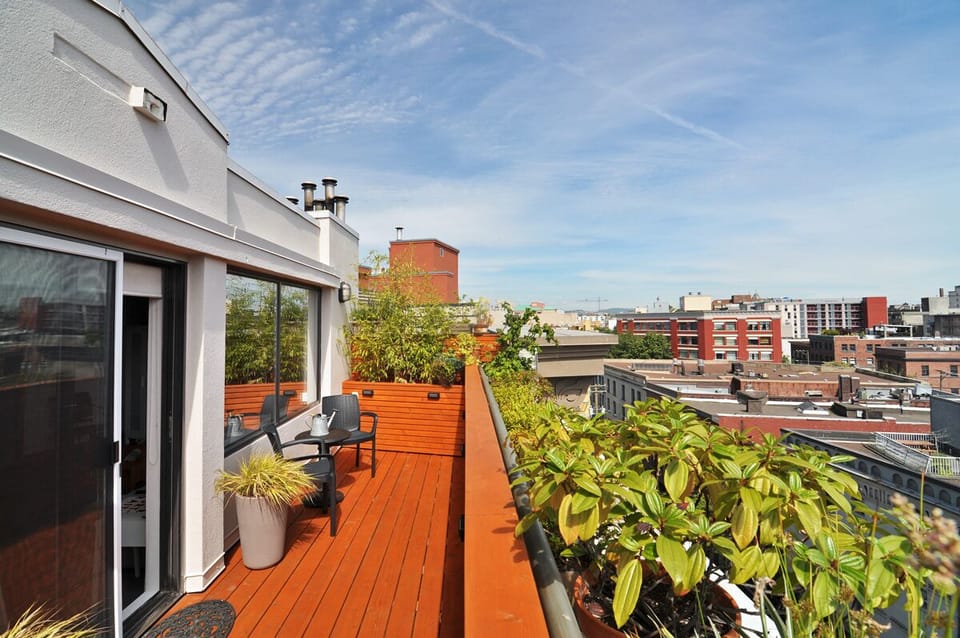 Sweeping city view from your own private top floor south-facing deck