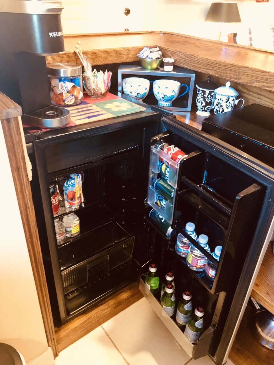 Mini fridge stocked with water and your favorite beverages 
