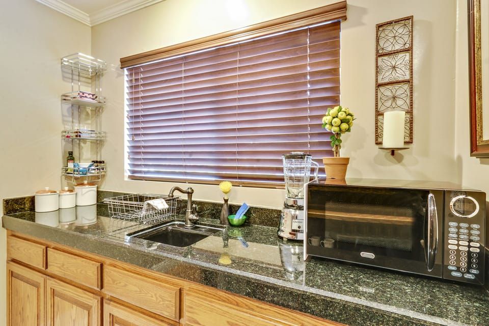 kitchenette w/ granite counter area 
