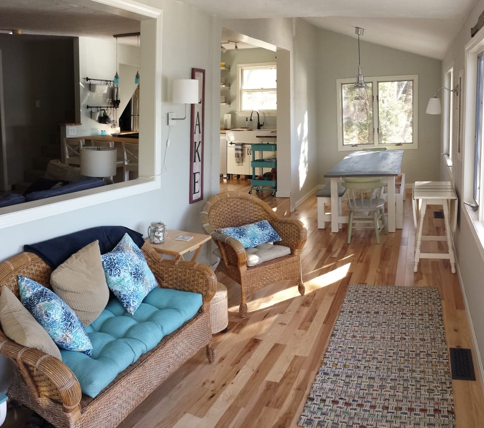Porch with lots of light and water views.  Sliding door opens to large deck.