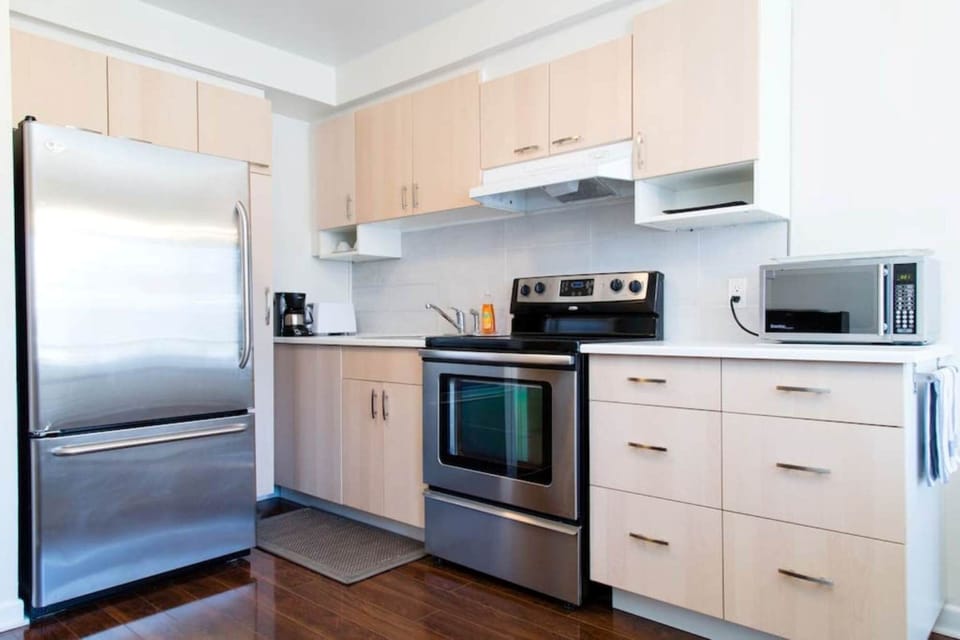 Modern kitchen equipped with full size appliances.