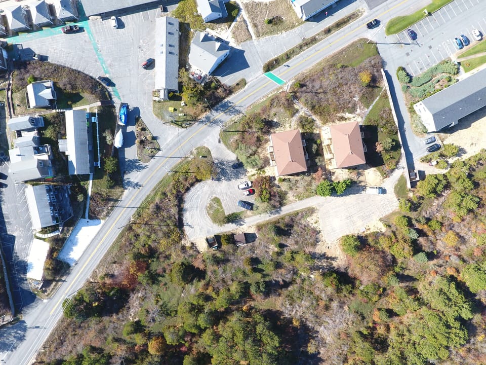View of the buildings from the air, bay across the street. 