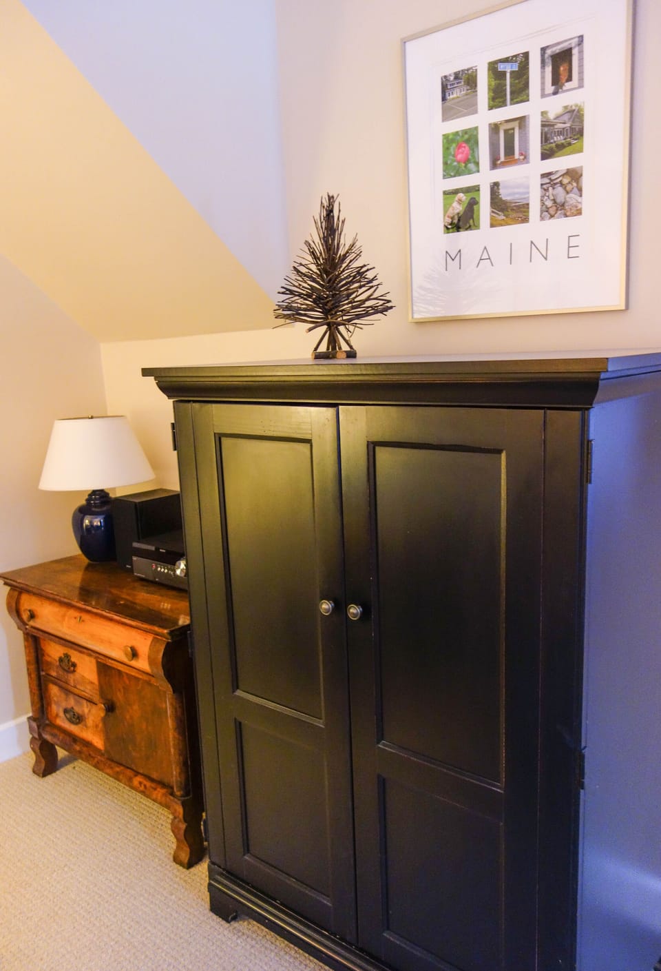 Flat-screen TV with Roku for streaming movies hides in a living room cabinet.