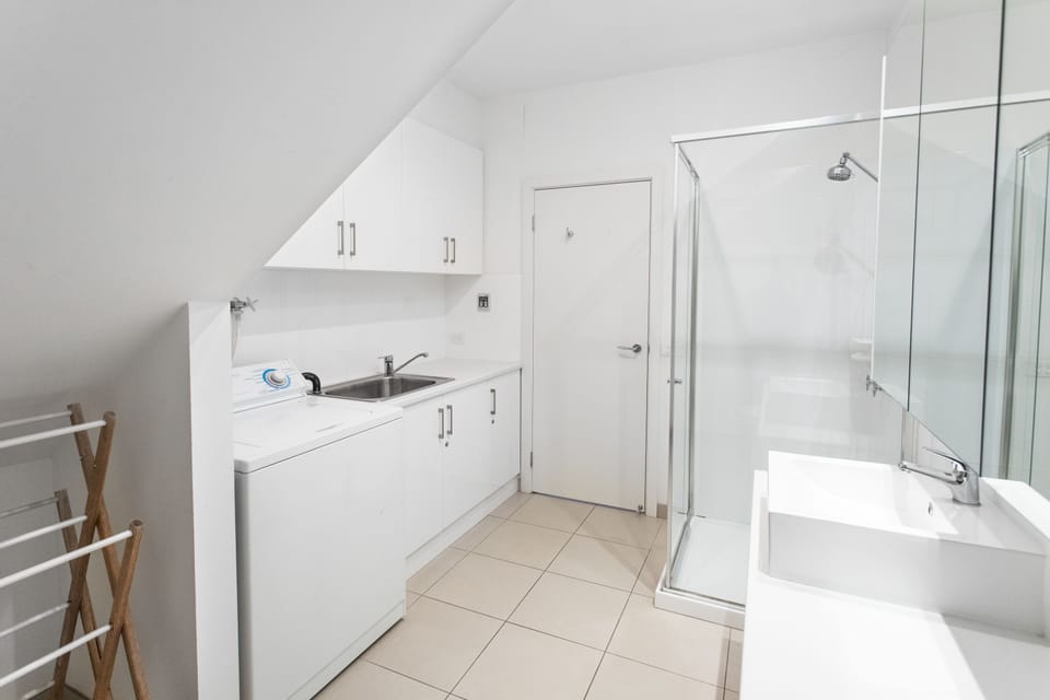 Main bathroom with laundry