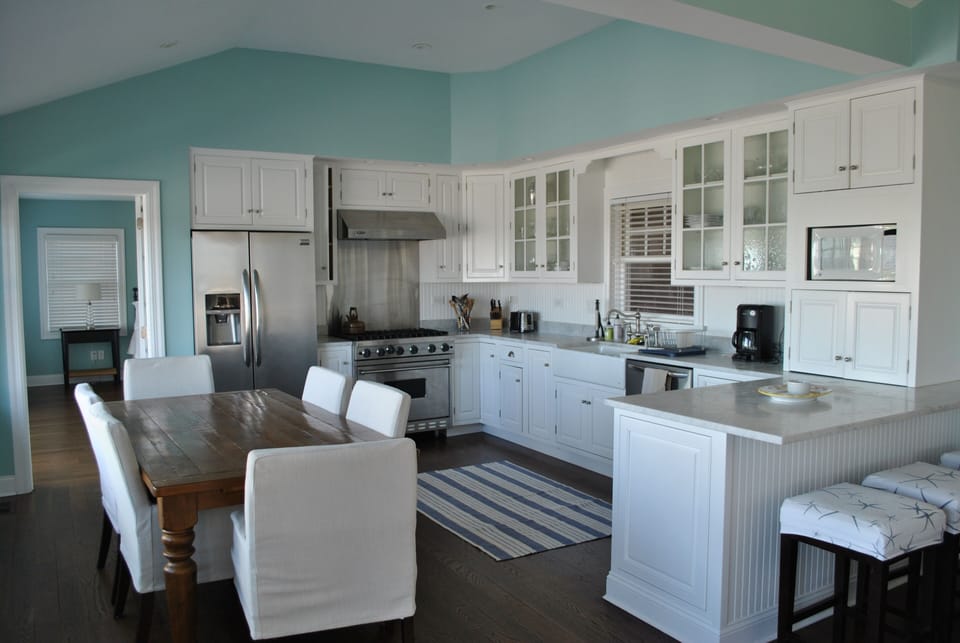 Fully equipped kitchen with Viking stove marble countertops and farmhouse sink