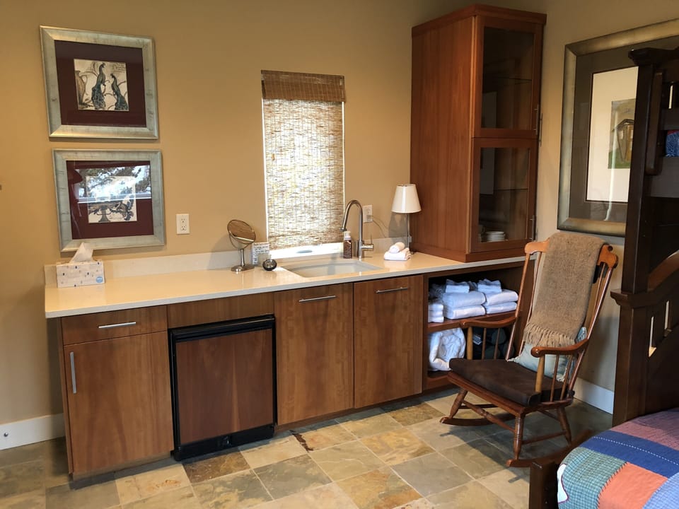 Main Suite with mini refrigerator & sink.