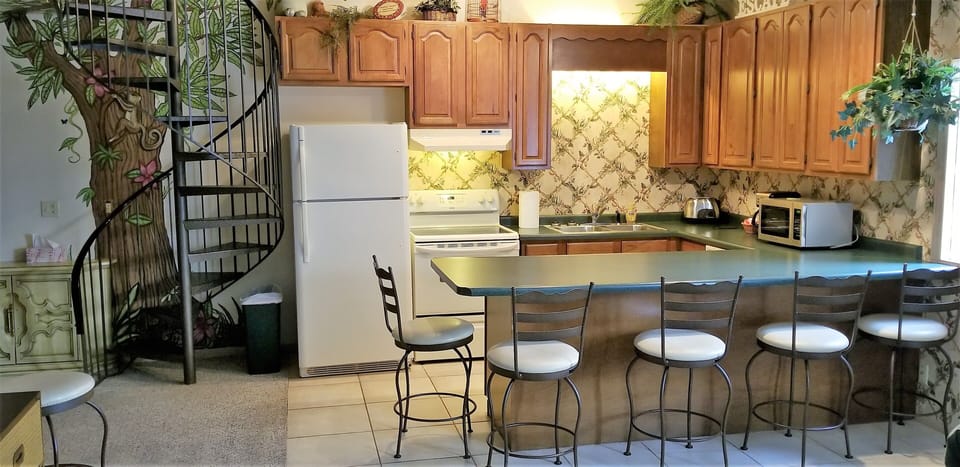 Spiral stairway to loft, Tree House