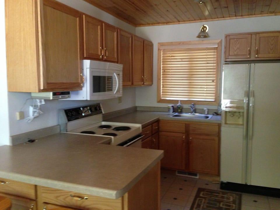 Kitchen. There are two stools for the breakfast bar,