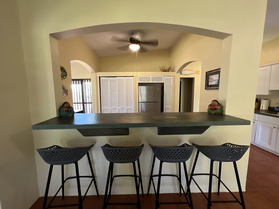 Breakfast bar, overlooking the kitchen of The Lower Palm, first floor home