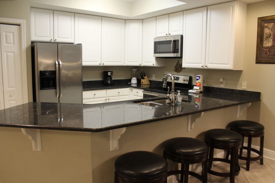 Kitchen with bar that seats four.