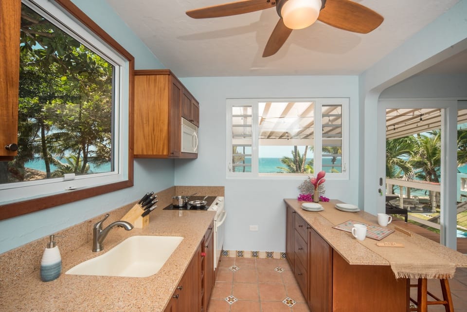 Fully stocked, ocean view kitchen makes it a true home-away-from-home.