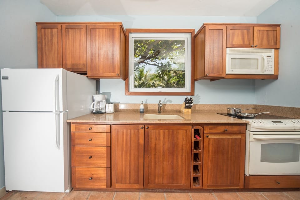 Oven, cooktop, fridge/freezer, microwave, coffee maker, toaster, pots/pans, etc.
