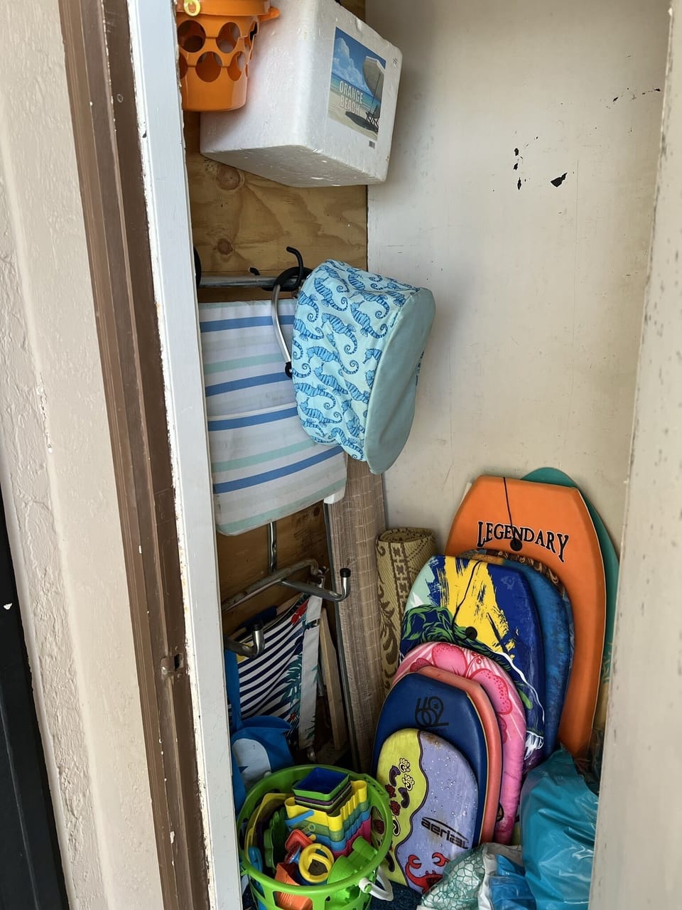 Balcony closet filled with things to use at the beach!