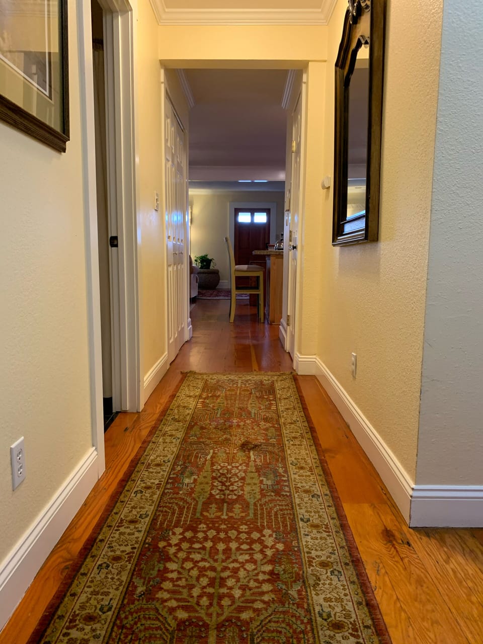 Hallway, guest bathroom on left 