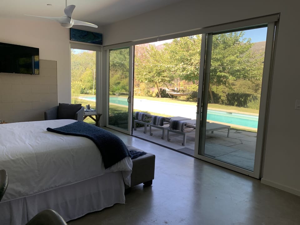 view from the queen-sized bed; blackout shades on windows and sliders