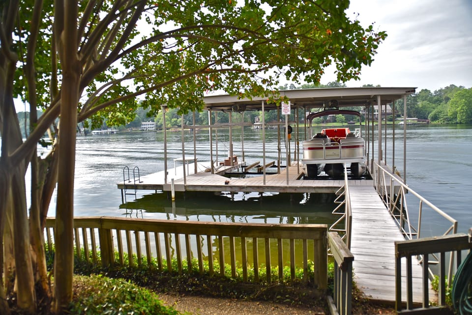 Dock and swim platform. The pontoon boat shown is not available for rent.