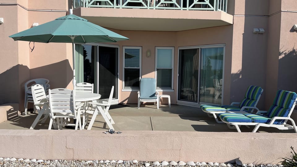 Ocean front condo with an oversized patio, ideal for outdoor dining
