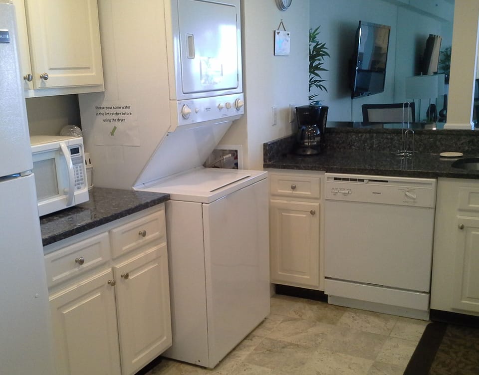 Sparkling New Granite countertops and updated cabinets with washer/dryer