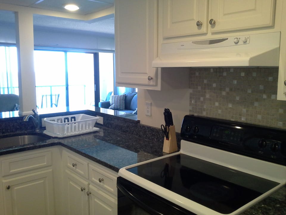 Sparkling New Granite countertops and updated cabinets. 