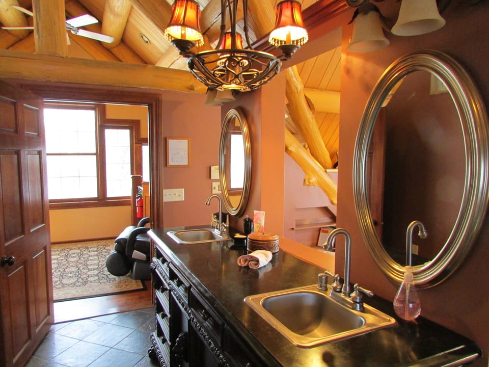The Master Suite vanity with massage chair in the reading nook
