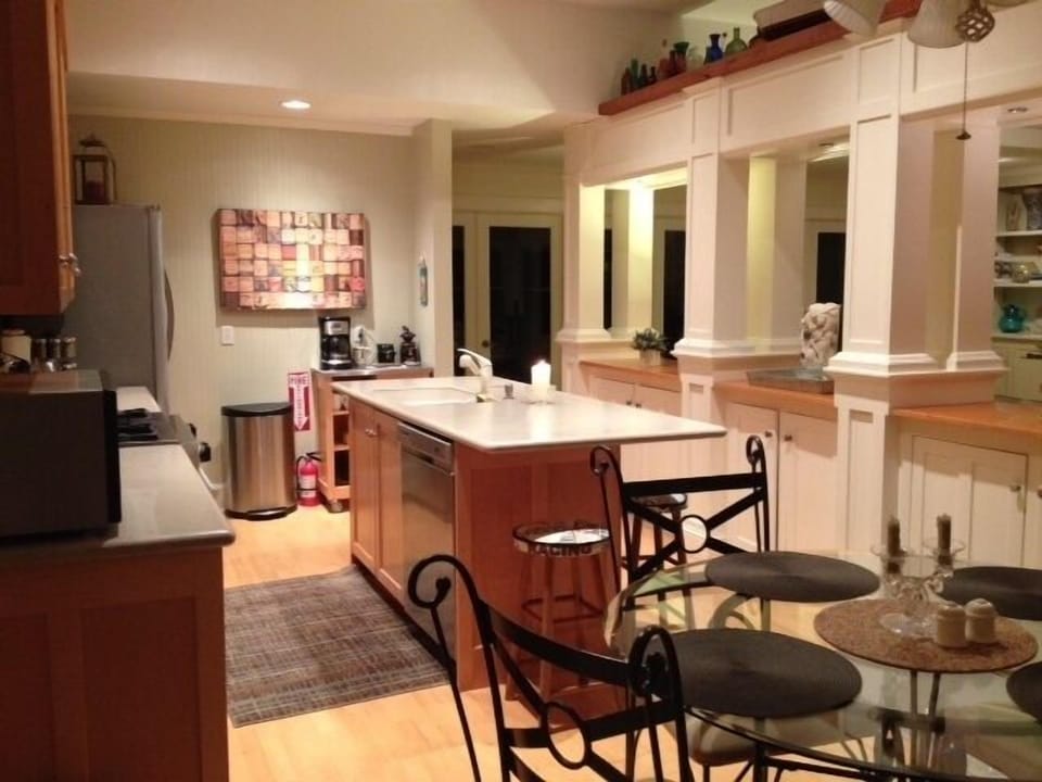 Handsome divider between kitchen and living room.  Convenient eat in area too!