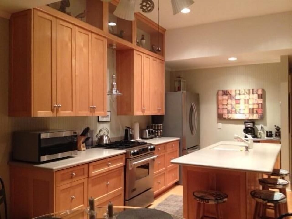 Custom maple cabinets and stainless steel appliances  with view of the Bay