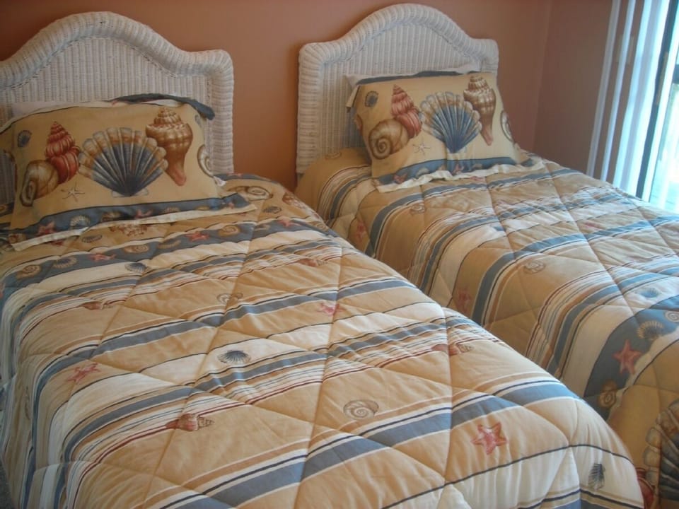 Single beds in second bedroom.