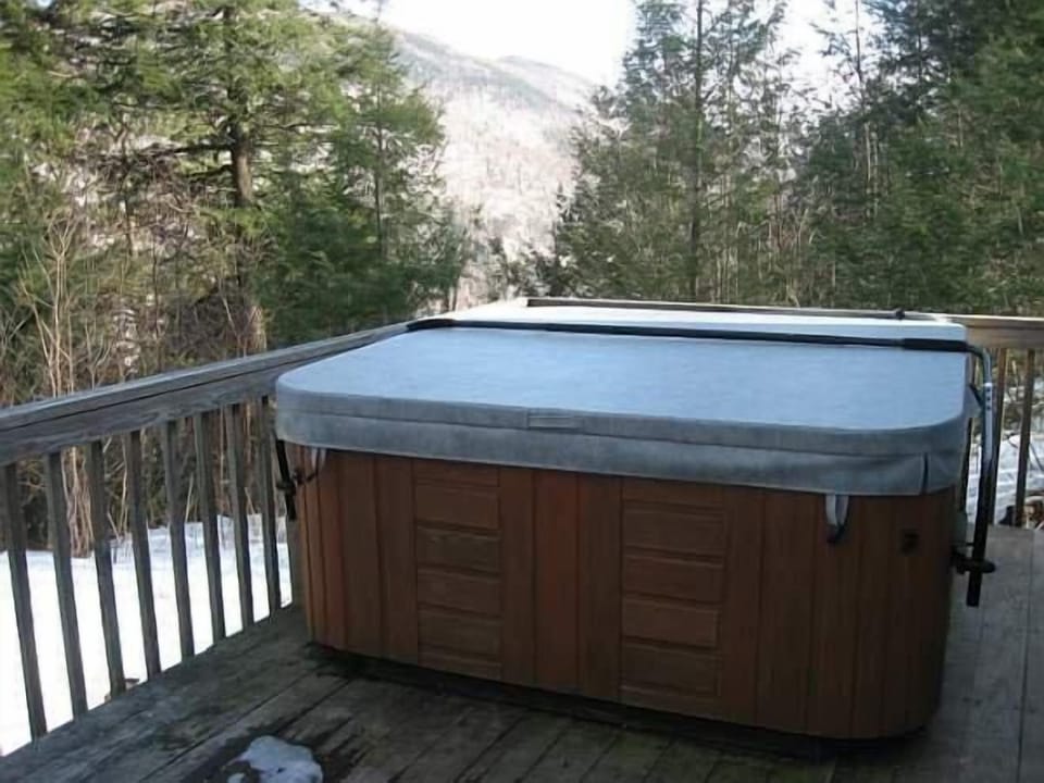 Hot tub on back deck with mountain views