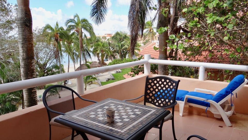 Spacious oceanfront balcony overlooking the beach