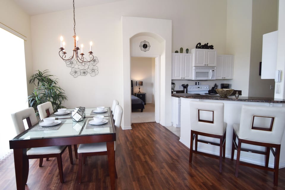 Formal dining area and breakfast bar with stools