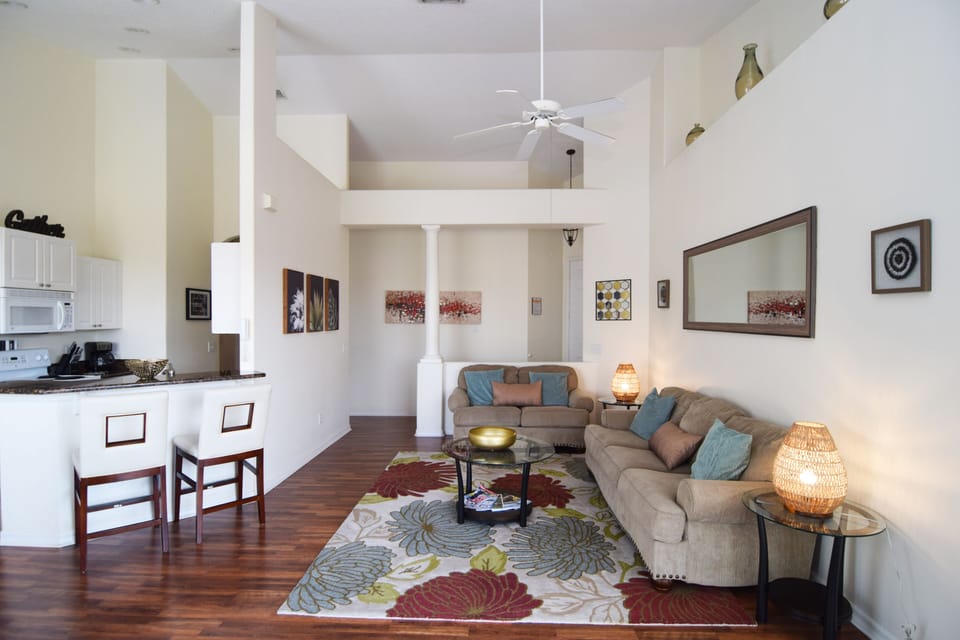 Stylish and comfortable open-plan living space, Smart TV, doors to the pool deck