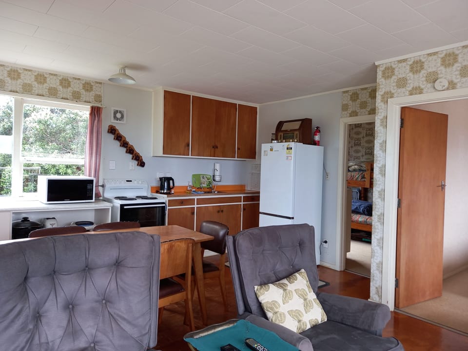 Kitchen/dining area- showing the doorways into the bunk room and main bedroom