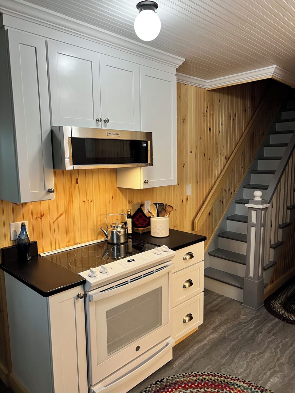 Kitchen radiant stove top and oven; microwave; and outdoor venting.