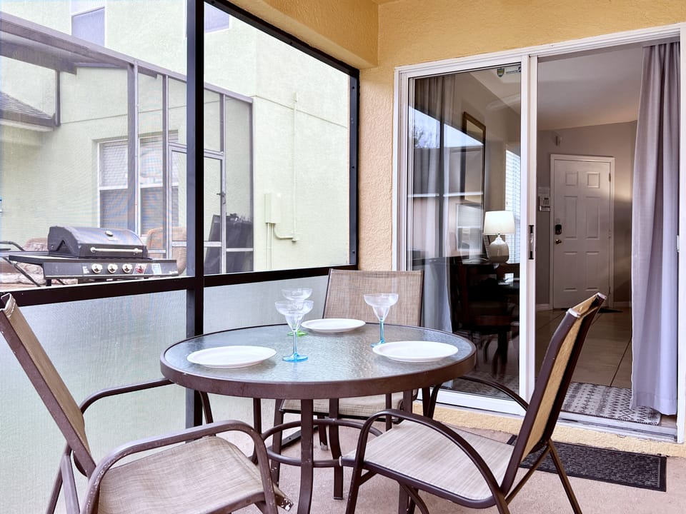 A covered lanai overlooks the enclosed heated pool.