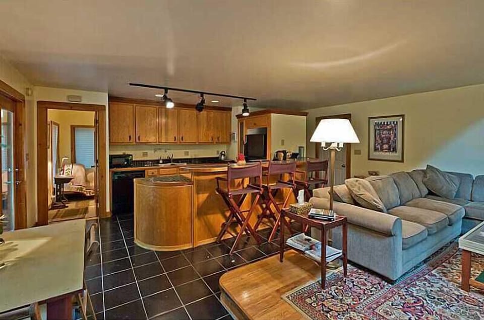 VIEW OF KITCHEN FROM DEN