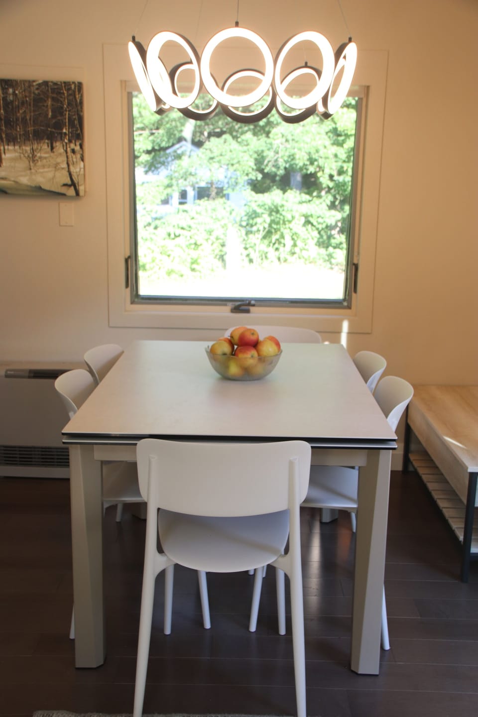 Expandable table with a picture window overlooking the backyard and Jewel brook 