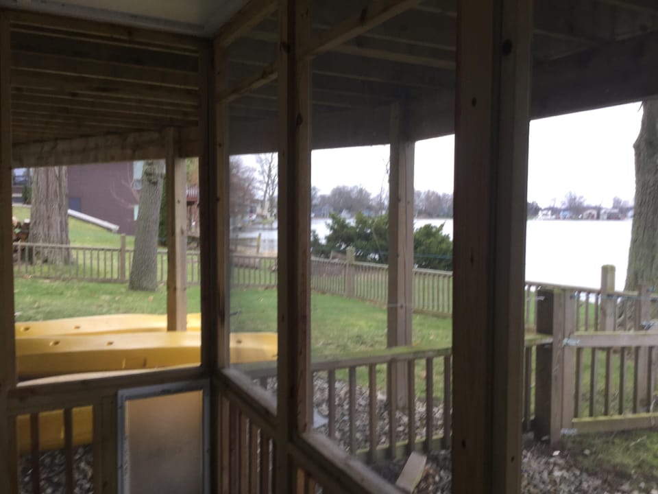 Dog run fenced in area off the screened porch at lake level.