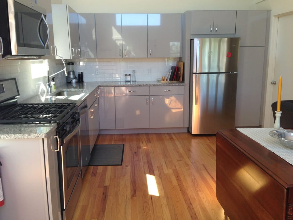 Sizable kitchen with stainless steel appliances and all the amenities