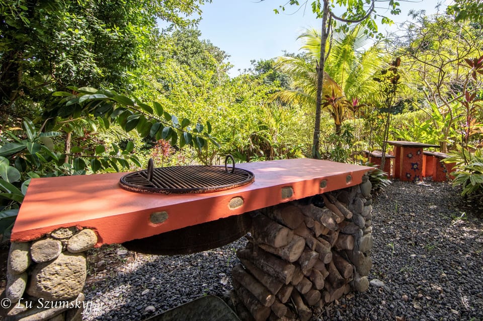 Stone grill, work of a Calibishie artisan. Charcoal made at Pointe Baptiste