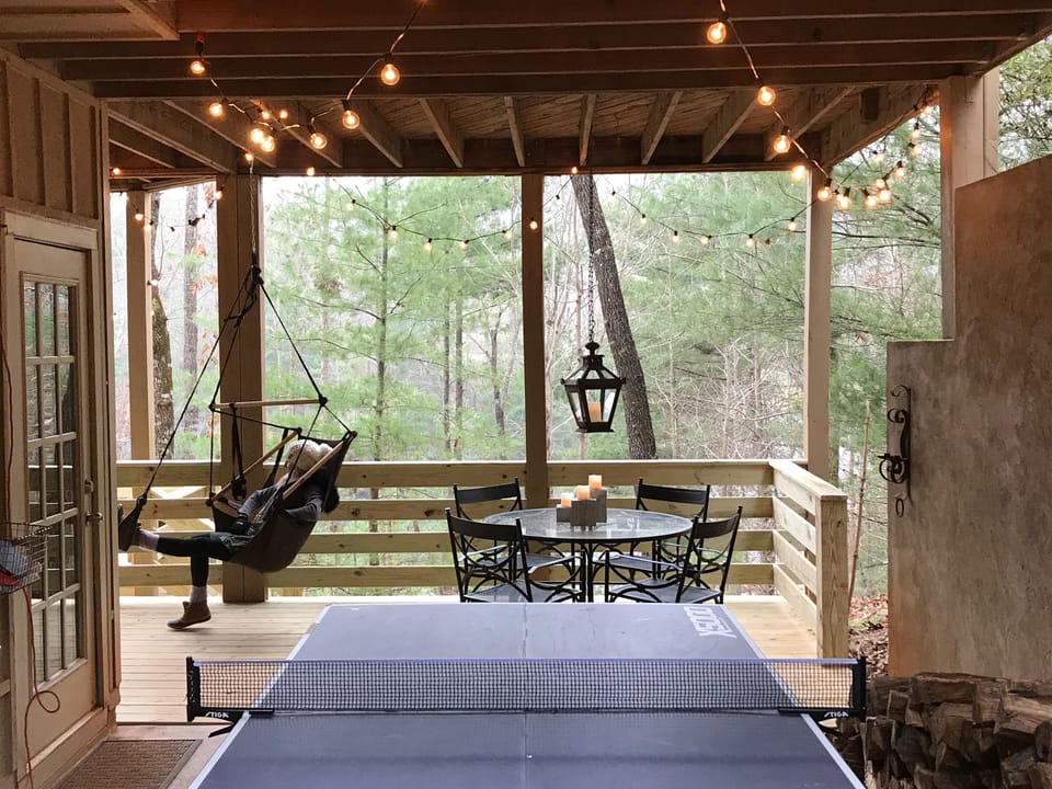 Lower deck w ping pong, floating daybed, game table, lounger, hammock, fire pit