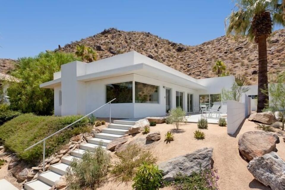 Mid-century hillside home - level in and out. Casita and garage right of wall.