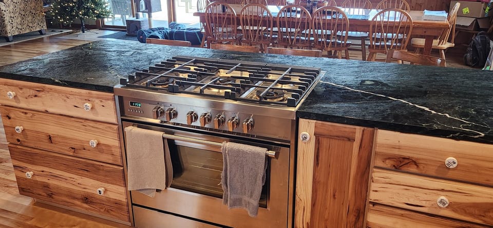 36" dual fuel verona range set in Vermont Verde stone counter