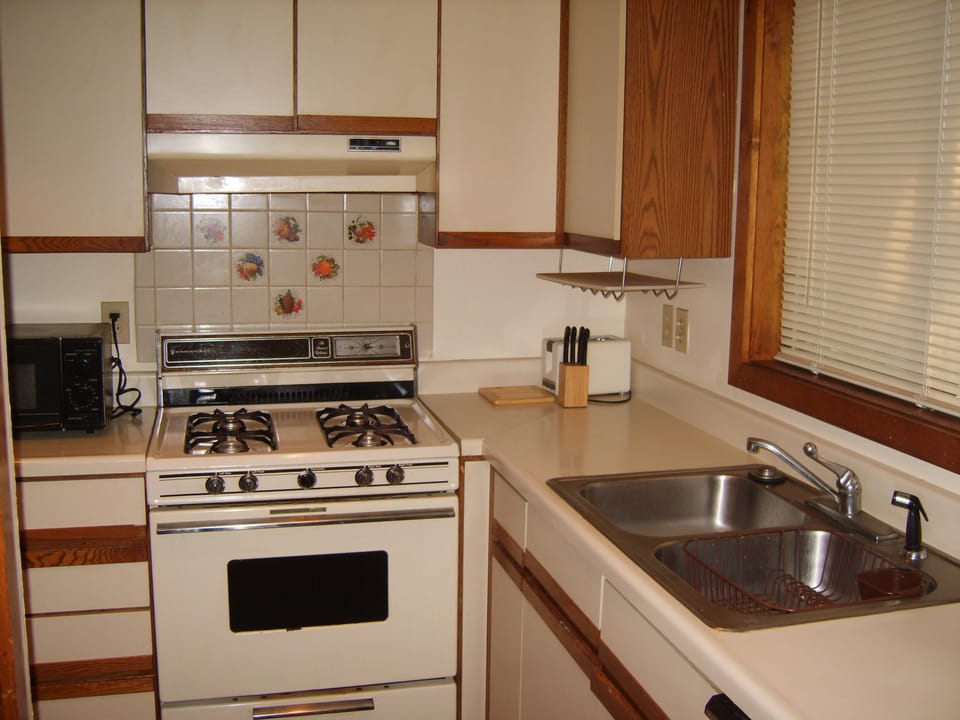 Kitchen includes oven/stove, refrigerator, dishwasher, microwave