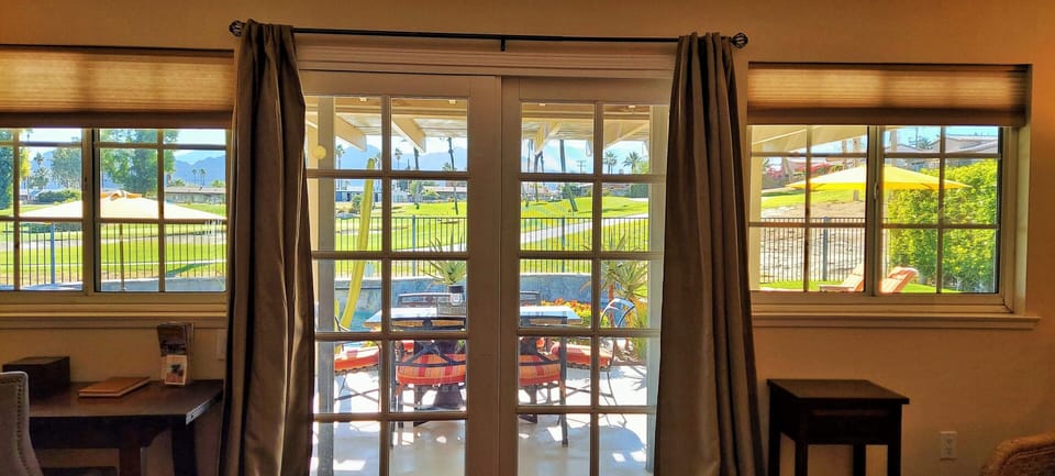Living room opens to the patio with mountain views