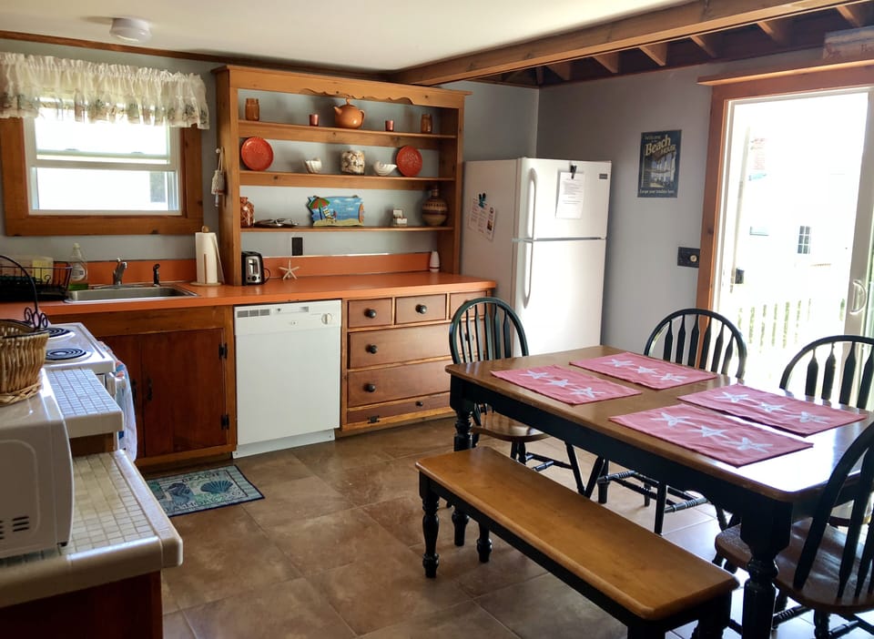 Updated flooring, oven and refrigerator in the large kitchen.