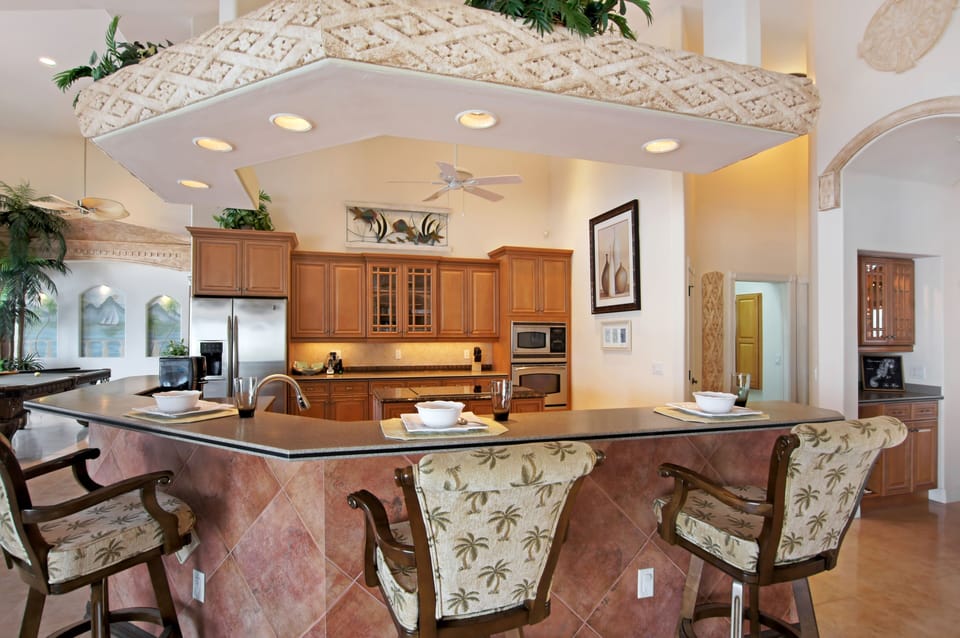 There is additional seating for 3 at the breakfast bar in the kitchen