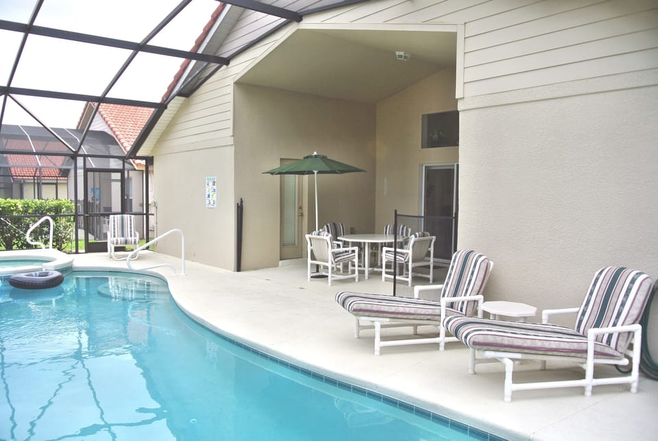 West facing pool with child safety fence and large pooldeck with lanai