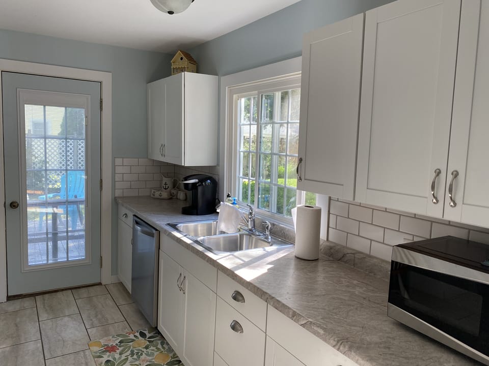 Kitchen- rear door to back deck. 