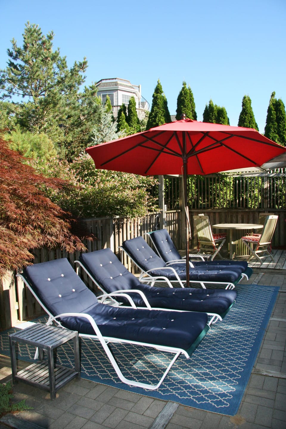 Lounge in the sun by pool with privacy.